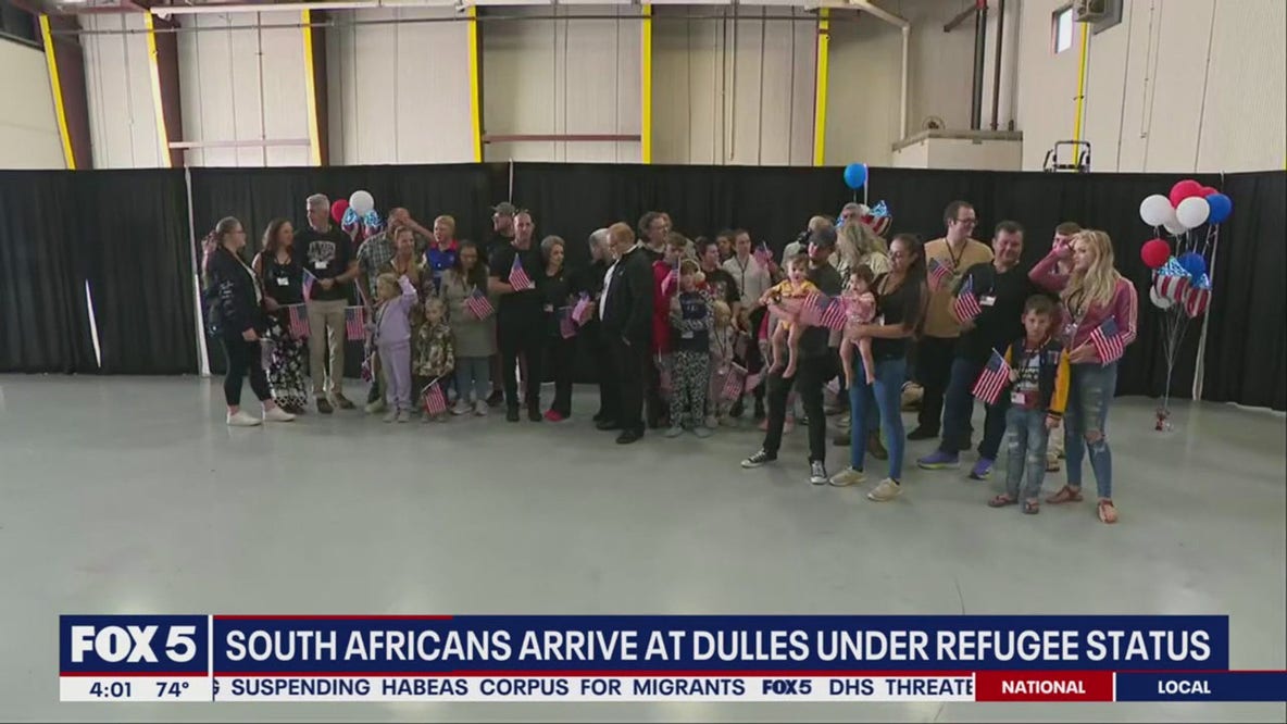 South Africans arrive at Dulles under refugee status